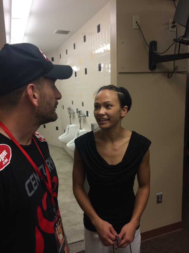 I love this shot I got backstage of Michelle Waterson discussing her fight with Greg Jackson. 